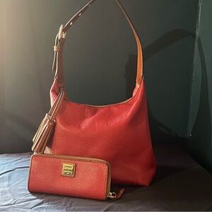 Dooney & Bourke red shoulder bag with matching wallet.